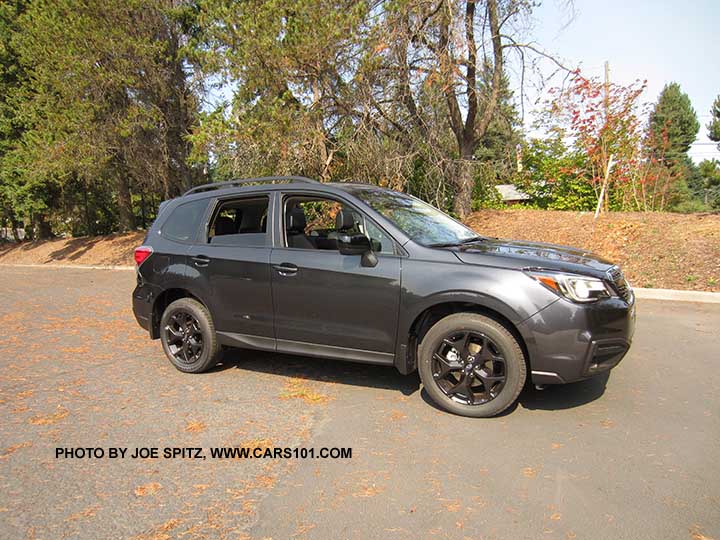 2018 Subaru Forester 2.5 Premium CVT Black Edition has black 18" alloys. Dark Gray color shown. Optional splash guards