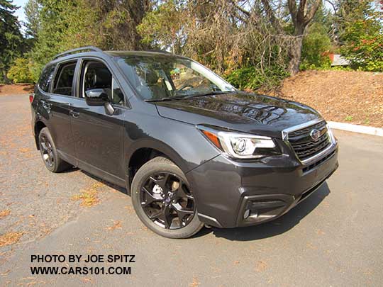 2018 Subaru Forester 2.5 Premium CVT Black Edition has black 18" alloys,  black outside mirrors, LED headlights, black badging... Dark Gray color shown.