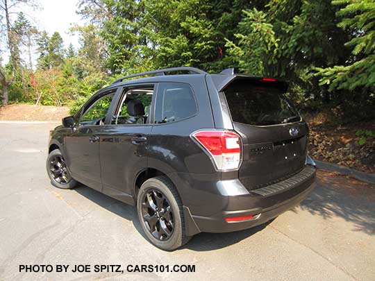 2018 Forester 2.5 Premium CVT Black Edition with black 18" alloys, black rear logos. dark gray shown with optional splash guards and rear bumper cover.