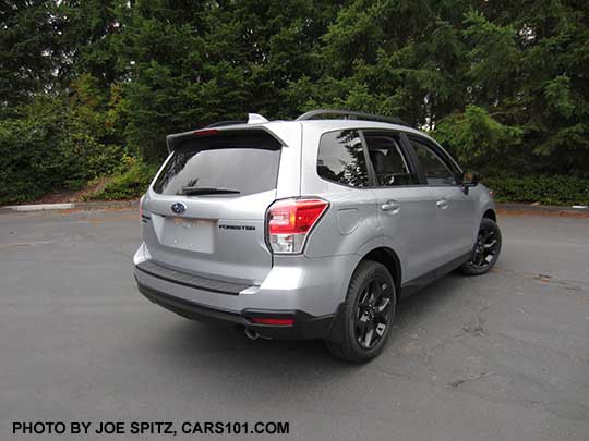 2018 Forester  2.5 Premium CVT Black Edition has black 18" alloys, black rear badging, stainless exhuast tip, Ice silver car shown with optional rear bumper cover, splash guards.