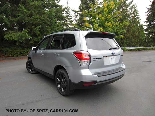 2018 Forester  2.5 Premium CVT Black Edition has black 18" alloys, black rear badging, Ice silver car shown with optional rear bumper cover, splash guards.