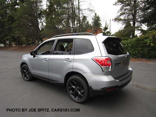 2018 Forester 2.5 Premium CVT Black Edition has black 18" alloys, black rear badging, Ice silver car shown with optional rear bumper cover, splash guards.