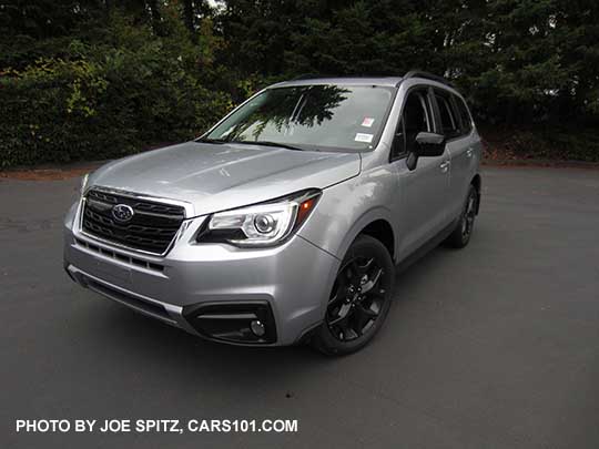 2018 Forester Premium Black Edition has black 18" alloys, black outside mirrors, black sport grill with chrome frame, fog lights.   Ice silver  shown.
