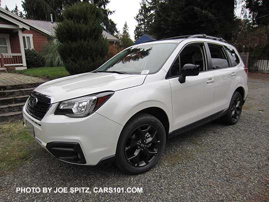 2018 Forester 2.5 Premium CVT Black Edition has black 18" alloys, black outside mirrors, black sport grill with chrome frame, fog lights,    White car shown.