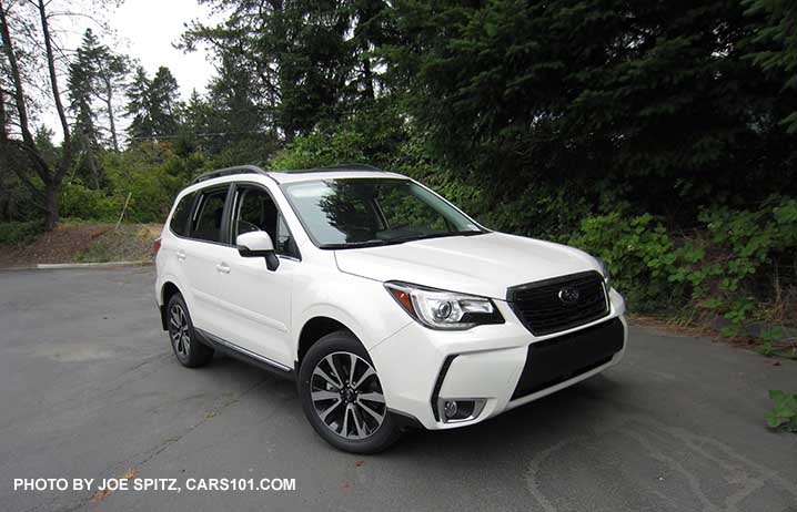 2018 Subaru Forester XT Touring. White shown. Optional side moldings