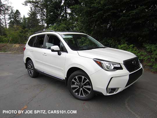 2018 Subaru Forester XT Touring has 18" alloys, turn signal outside mirrors.. White shown. Optional side moldings.
