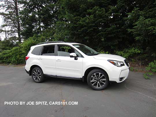 2018 Subaru Forester XT Touring has 18" alloys, turn signal outside mirrors. White shown. Optional side moldings