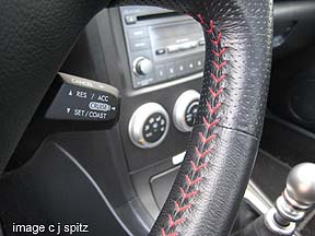 STI steering wheel with red stitching