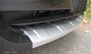 closeup of the front bumper underguard on the 2011 Impreza Outback Sport