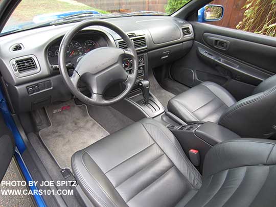 1998 Subaru Impreza 2.5RS interior, with the original carpeted 2.5RS floor mats. Aftermarket gray leather. Optional automatic transmission, optional CD player. Photo taken 11/2016