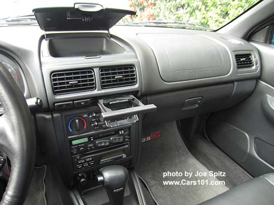 1998 Subaru Impreza 2.5RS center console with standard cassette player, showing the upper clamshell storage and pull out cup holder. Photo taken Nov 2016
