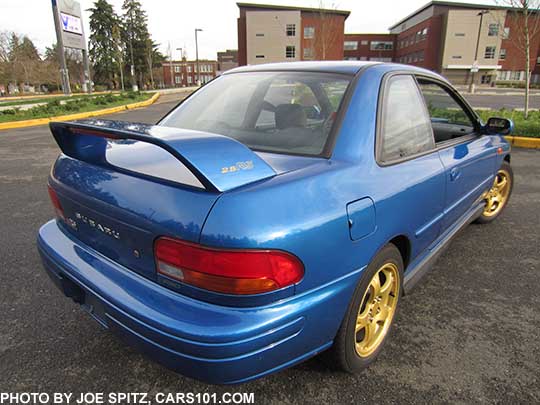 rear view 1998 Impreza 2.5RS coupe, world rally blue, rear spoiler, gold wheels, optional side moldings. Photo taken 11/2016