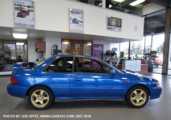 1998 2 door Impreza 2.5 RS Coupe, rally blue, gold wheels, on the dealership showroom floor December 2016