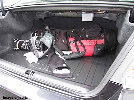 golf clubs in nthe back of the impreza sedan