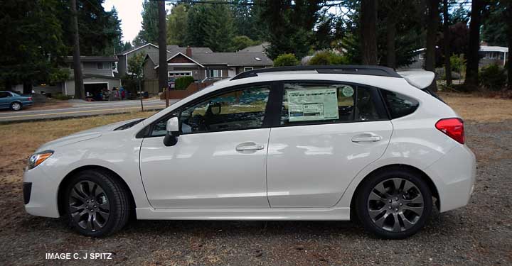 2014 and 2013 white  subaru 5 door impreza with optional rear spoiler