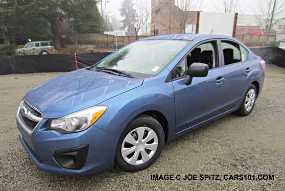 quartz blue 2014 subaru impreza sedan, in the rain