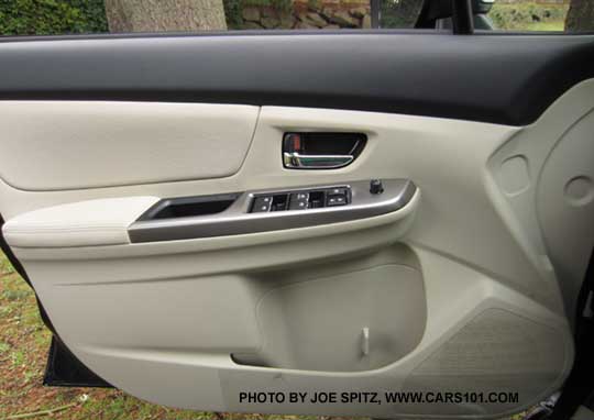 2015 Subaru Impreza Premium driver's door with bright inner door handle. Ivory shown