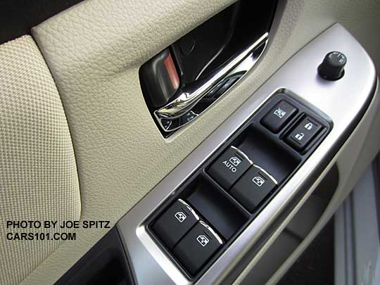 2015 Impreza chrome inner door handle and bright edged power window switches. Warm Ivory shown.