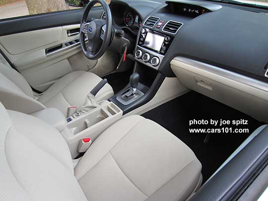 2015 Subaru Impreza warm ivory interior. Premium shown with silver shift surround, from Passenger side