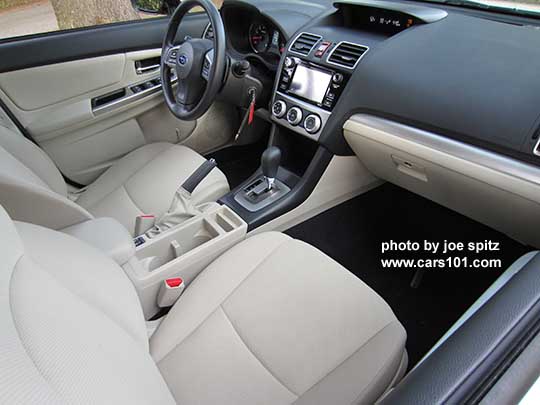 2015 Subaru Impreza warm ivory interior. Premium shown with silver shift surround, from Passenger side
