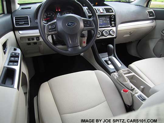 2015 Subaru Impreza warm ivory interior. Premium shown with vinyl wrapped steering wheel and silver shift surround