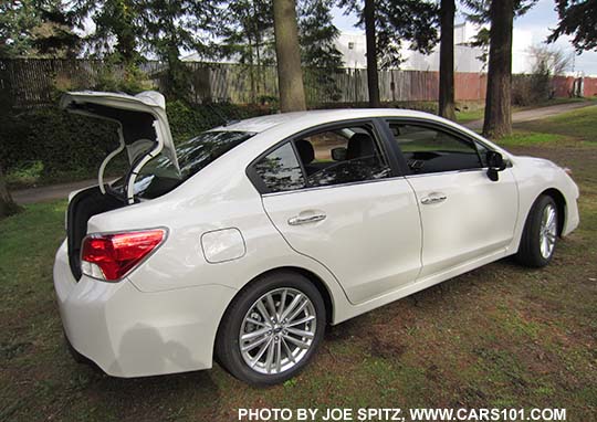 2015 Subaru Impreza Limited 4 door sedan with trunk open, crystal white shown