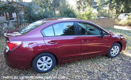 side view 2015 Subaru Impreza 2.0i sedan. Venetian red shown