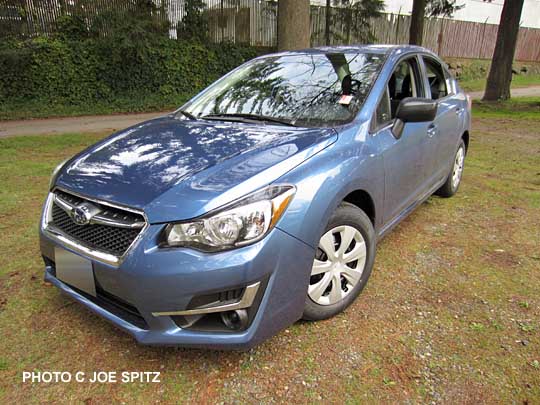 2015 Impreza 2.0i base model base model 4 door sedan. Quartz blue color shown