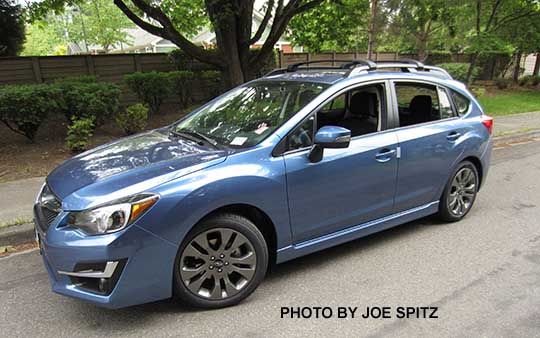 2015 Impreza Sport 5 door hatchback, Quartz Blue color.  All Sports have roof rack rails, gray alloys, turn signal mirrors...