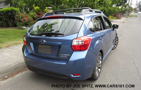 rear view 2015subaru  Impreza Sport 5 door hatchback, Quartz Blue. With roof rack rails
