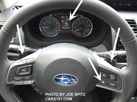 2015 Subaru Impreza Limited steering wheel, shown with optional Eyesight. See white arrows.