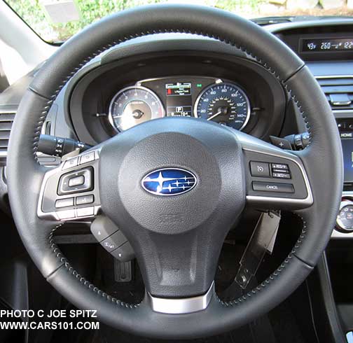 2015 Impreza 2.0i Limited and Sport Limited leather wrapped steering wheel with 3 buttons to control the instrument panel center LCD info display