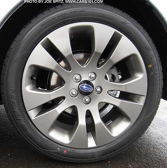 2015 Subaru Impreza Sport 17" gray alloy wheel with black center cap with blue logo
