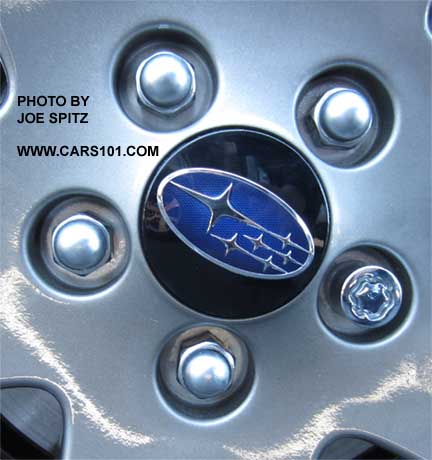 close-up of the 2015 Subaru Impreza Sport 17" alloy wheel with black center cap with blue logo