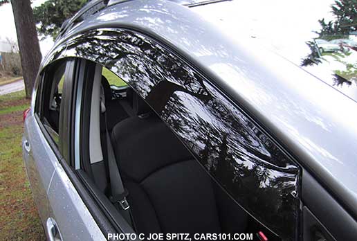 close-up of the 2015 impreza 5 door with optional side window deflectors, rain drip moldings, ice silver shown