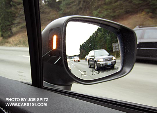2017 Subaru Impreza blind spot detection symbol in the outside passenger side mirror housing