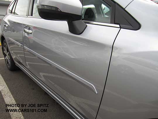 closeup of the 2017 Subaru Impreza 5 door with optional body colored, body side moldings. ice silver shown.
