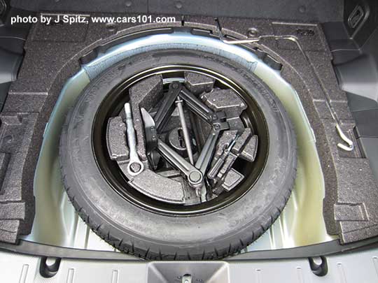 2017 Subaru 2017 Subaru Impreza 5 door hatchback spare tire and tools under the cargo floor.