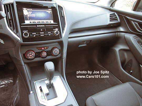 2017 Subaru Impreza Premium center console with silver shift surround, manual heat/ac controls, 6.5" audio