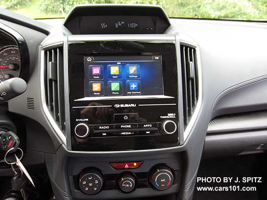 2017 Subaru Impreza 2.0i base model console, 6.5" audio, manual heat/ac controls.