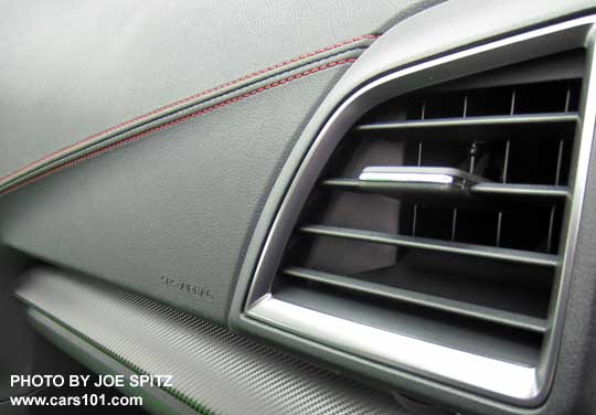 closeup of the 2017 Subaru Impreza Sport dash with patterned trim, medium gray vent trim, and red stitched accent line