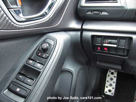 2017 Subaru Impreza Sport driver's door panel, with chrome inner door handle. Notice the metal foot rest