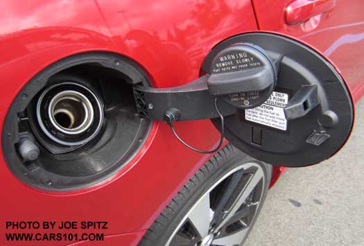 2017 Subaru Impreza fuel door and gas cap tethered, in the holder. Regular unleaded gas.