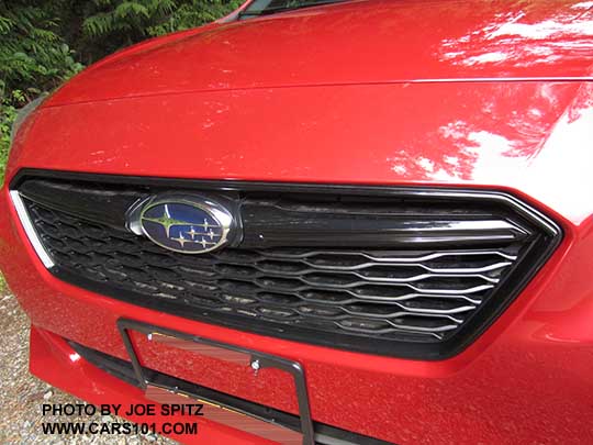 2017 Subaru Impreza Sport front grill has a gloss black accent bar, Lithium red car