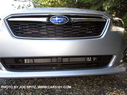 2017 Subaru Impreza front grill, ice silver shown. Limited model shown with the Active Grill Shutter open so you can see the radiator