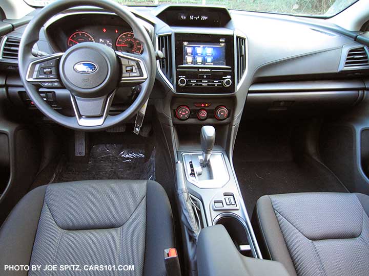 2017 Subaru Impreza Premium vinyl steering wheel, steering wheel, dash, silver shift surround, heated seat buttons black cloth drivers seat