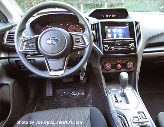 2017 Subaru Impreza Premium vinyl covered steering wheel, silver shift surround, black cloth drivers seat