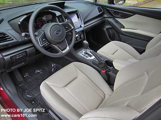 2017 Subaru Impreza 2.0i interior, CVT with silver surround, 6.5" audio screen, ivory cloth shown.