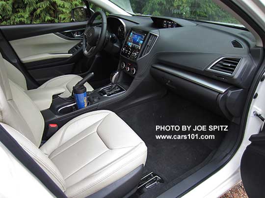 2017 Subaru Impreza Limited leather front seats, CVT gloss black shift knob and surround, 8" audio,  heated seat buttons, two fixed cupholders (with blue travel mug shown). ivory leather shown.