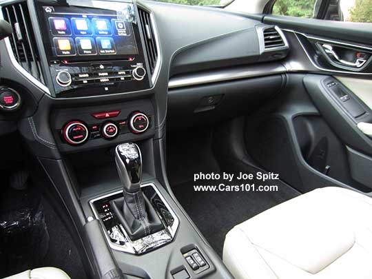 2017 Subaru Impreza Limited leather front seats, CVT gloss black shift knob and surround, 8" audio,  silver trimmed automatic climate control knobs, heated seat buttons, ivory leather shown.